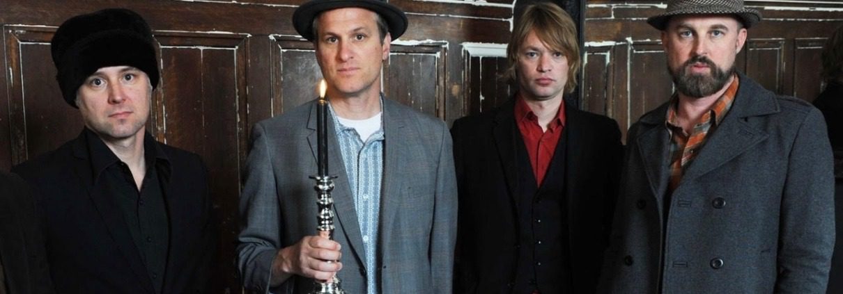 An image of the four musicians who make up the band CAKE