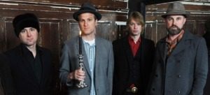 An image of the four musicians who make up the band CAKE