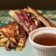 A St. Patty'd Melt sandwich with classic corned beef and cabbage