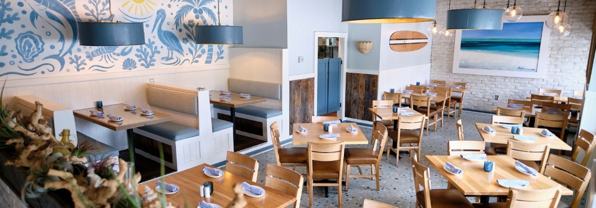 view of seafood restaurant dining room with ocean beach theme