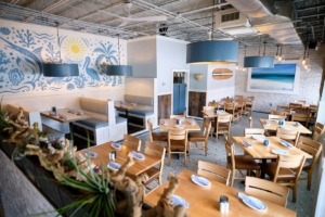 view of seafood restaurant dining room with ocean beach theme