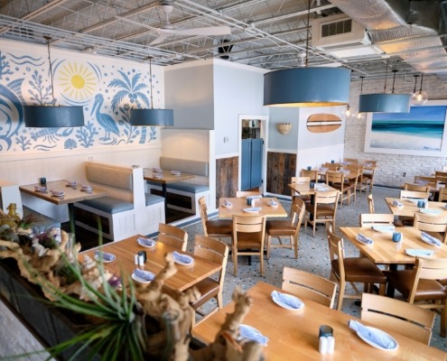 view of seafood restaurant dining room with ocean beach theme